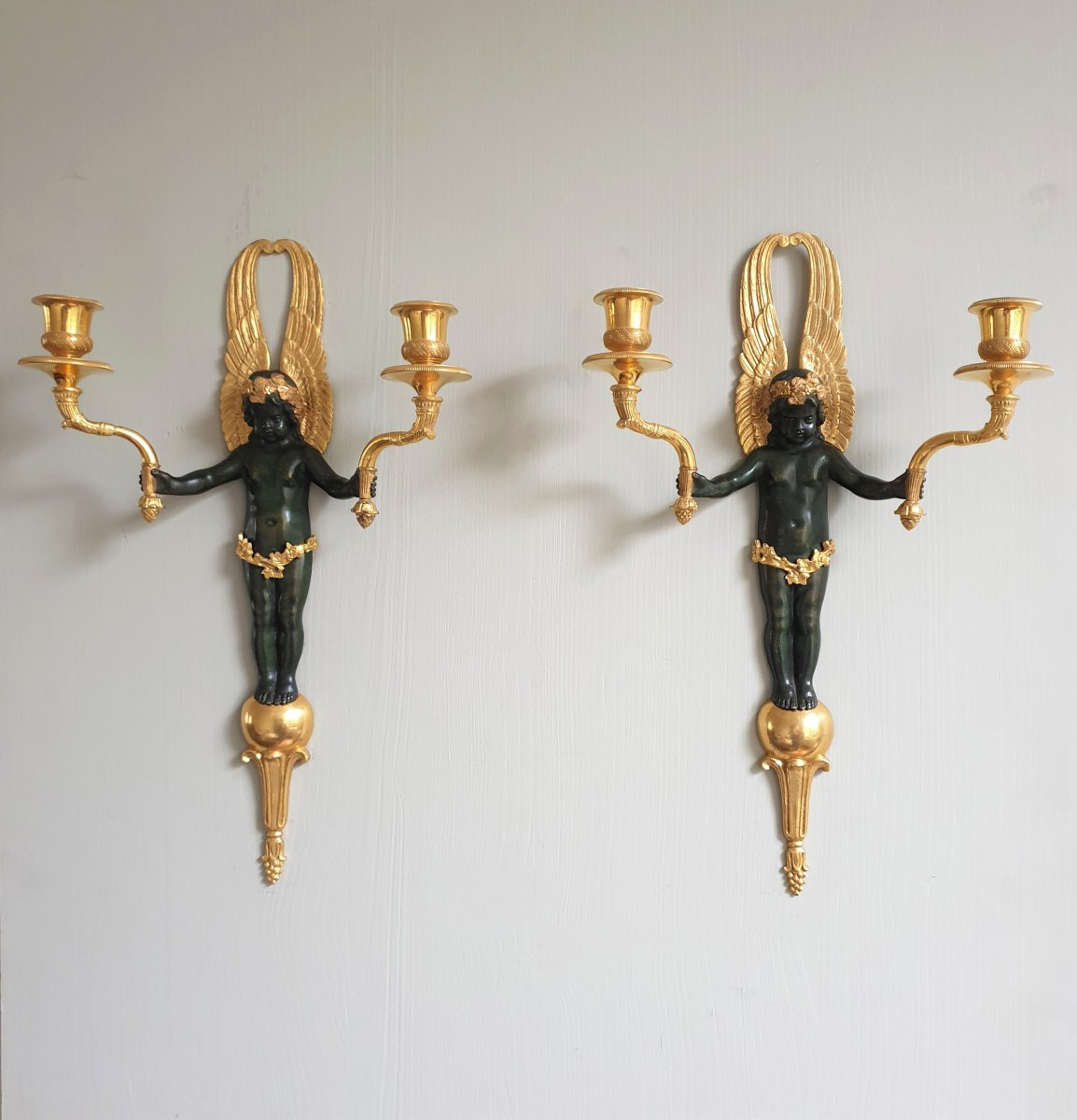 Pair of Restauration period gilt-bronze and patinated bronze sconces