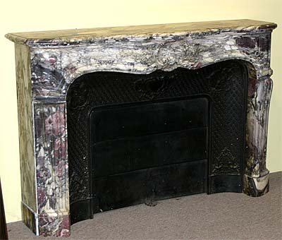 French, Louis XV-Louis XVI Transition, marble fireplace mantel and complementing cast iron surround