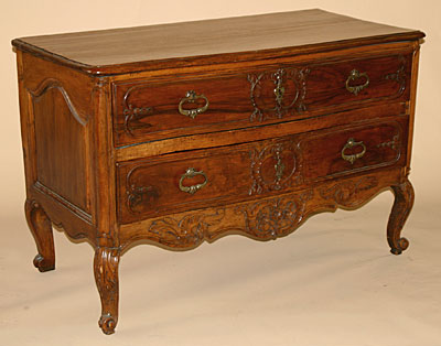 French, 18th century, carved sauteuse (two-drawer Provençal commode)
