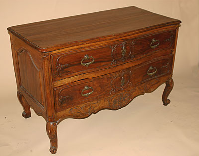 French, 18th century, carved sauteuse (two-drawer Proven&ccedil;al commode)