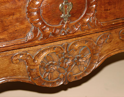 French, 18th century, carved sauteuse (two-drawer Proven&ccedil;al commode)