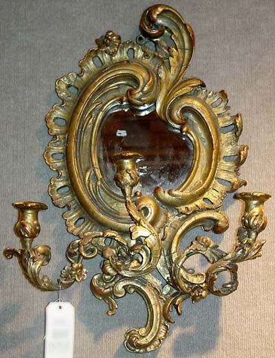 Pair of French, Louis XV style, giltwood and composition, three-arm mirror/sconces