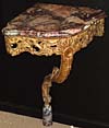 Pair of Louis XV period, carved giltwood corner consoles