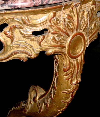 Pair of Louis XV period, carved giltwood corner consoles