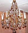 French, Louis XV style, gilt-iron and crystal, nine-arm chandelier