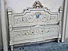 Italian, Neoclassical style, painted and parcel-gilded bed of large dimensions