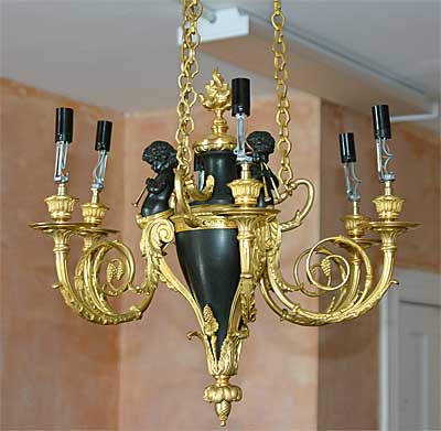 French, Neoclassical style, bronze d'ore and patinated bronze, six-arm chandelier