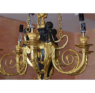 French, Neoclassical style, bronze d'ore and patinated bronze, six-arm chandelier