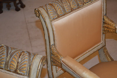 Set of ten Italian, neo-classical, cream painted and parcel gilt dining chairs