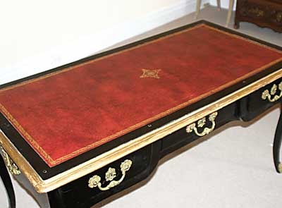 Italian, Regence period, black lacquer and gilt bronze bureau plat