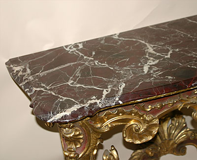 Fine pair of Continental, Louis XV style, red painted and parcel gilded console tables