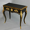 Fine, French, Napoleon III period, black lacquer, gilt bronze, and incised gilt brass table a jeu (game table)