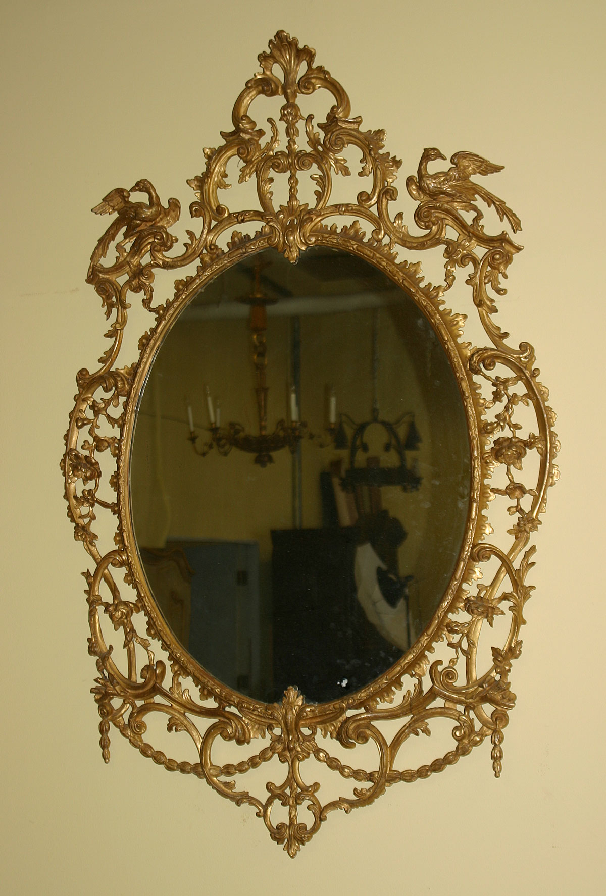 George III period, oval, carved giltwood mirror