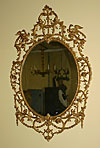 George III period, oval, carved giltwood mirror