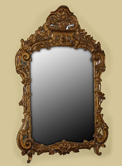 Very fine, French Provençal, Louis XV period mirror in solid, carved giltwood